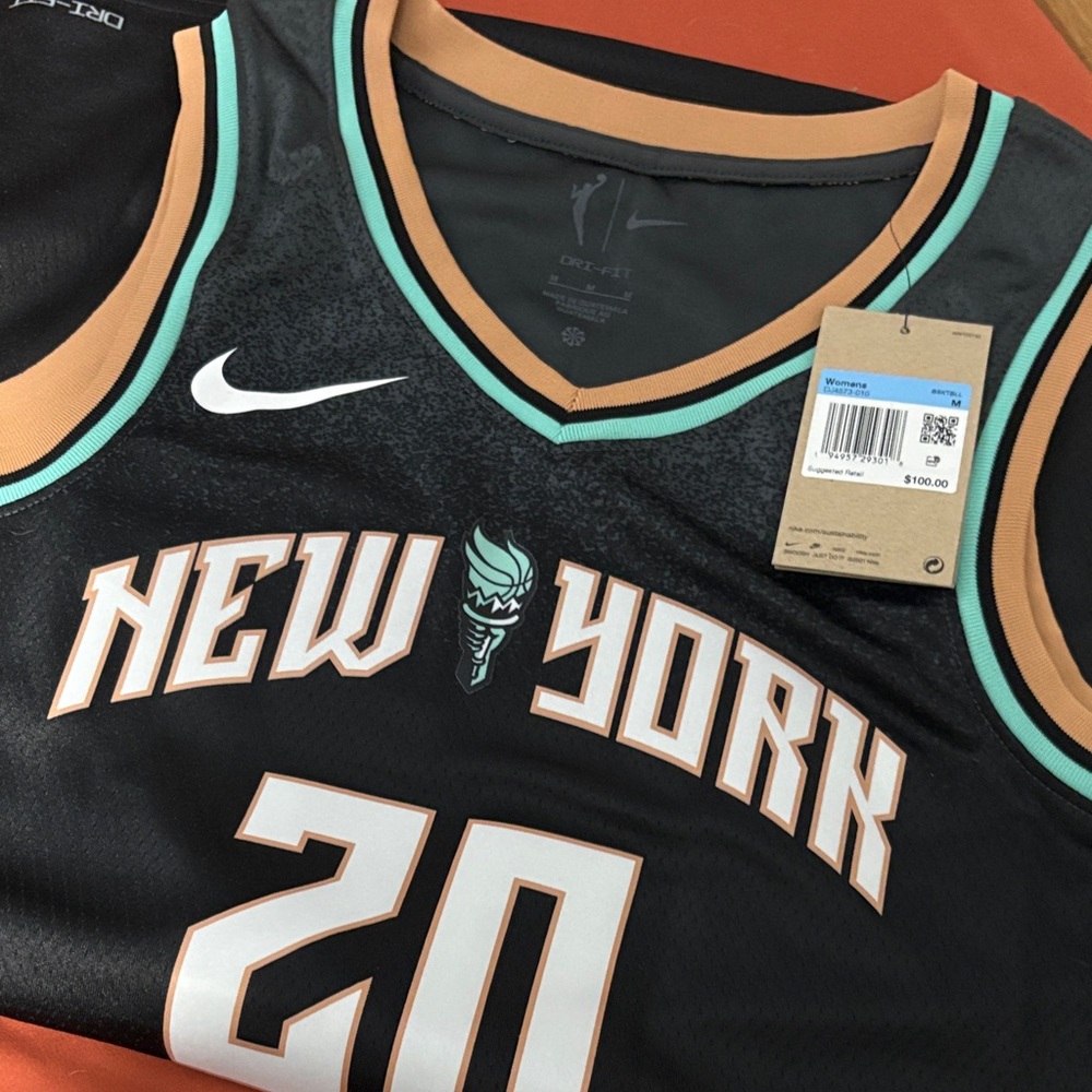 Nike Black New York Basketball Jersey with beige  and Teal Accents